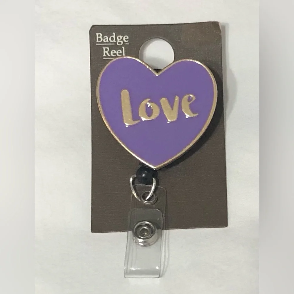 Love ID Badge  reel  gold and purple heart shaped. 24” pull cord.